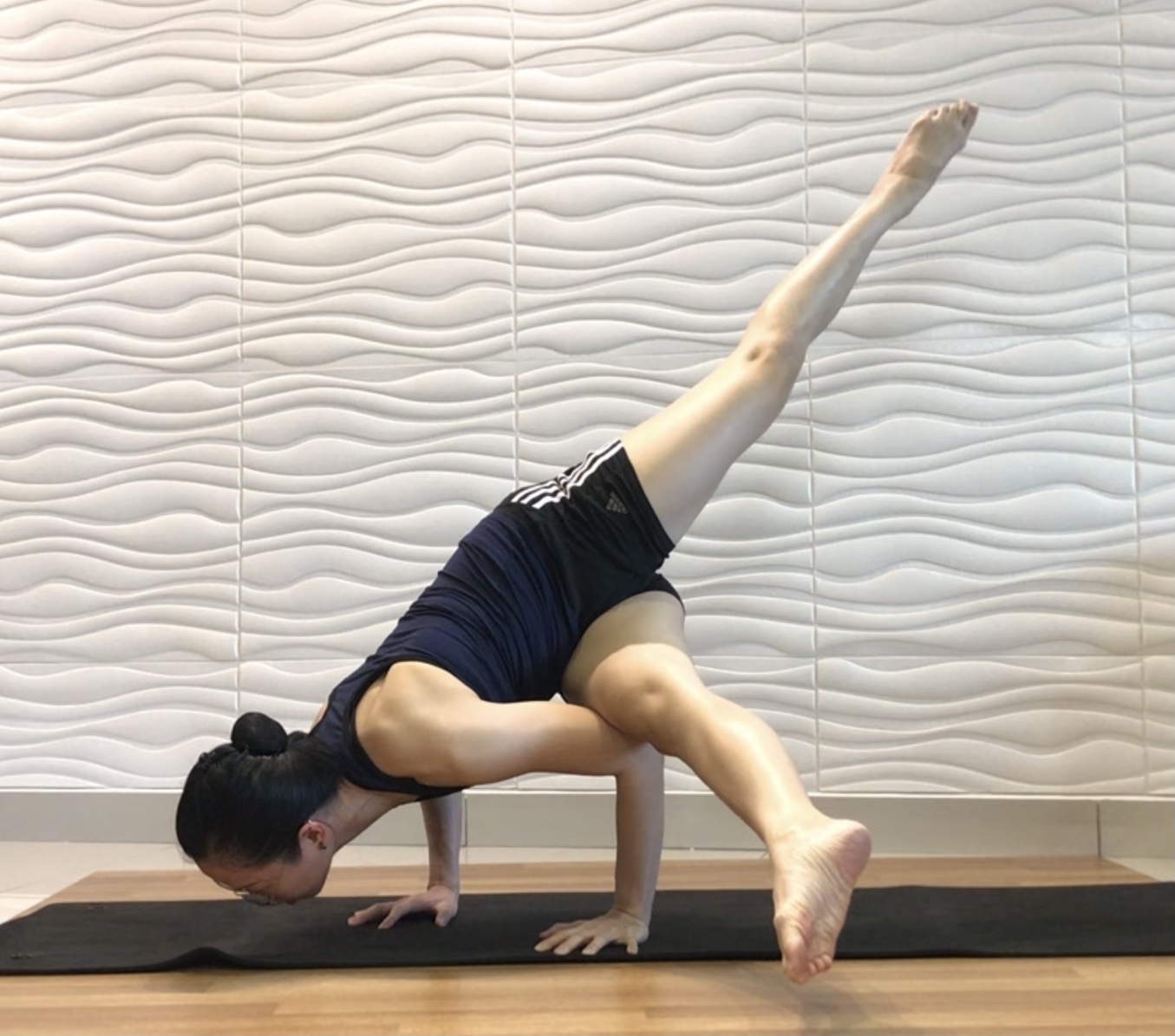 assisted locust pose/bow pose with the help of a strap.